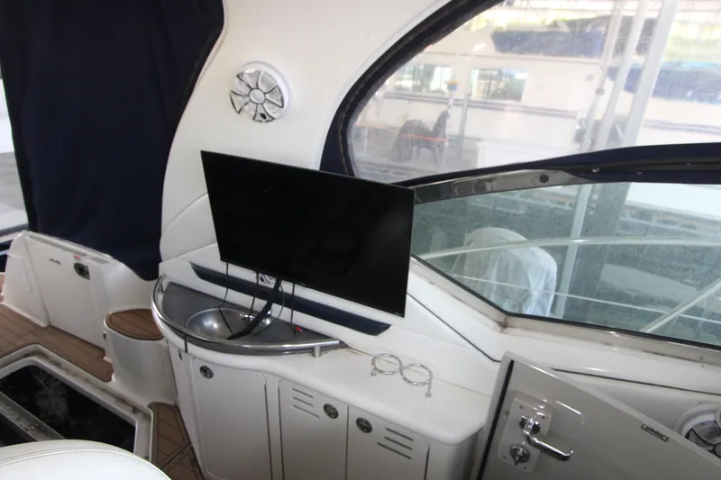 Slide: The Image of Interior of a 2005 Sea Ray 420 Sundancer yacht with TV and sink. - 8