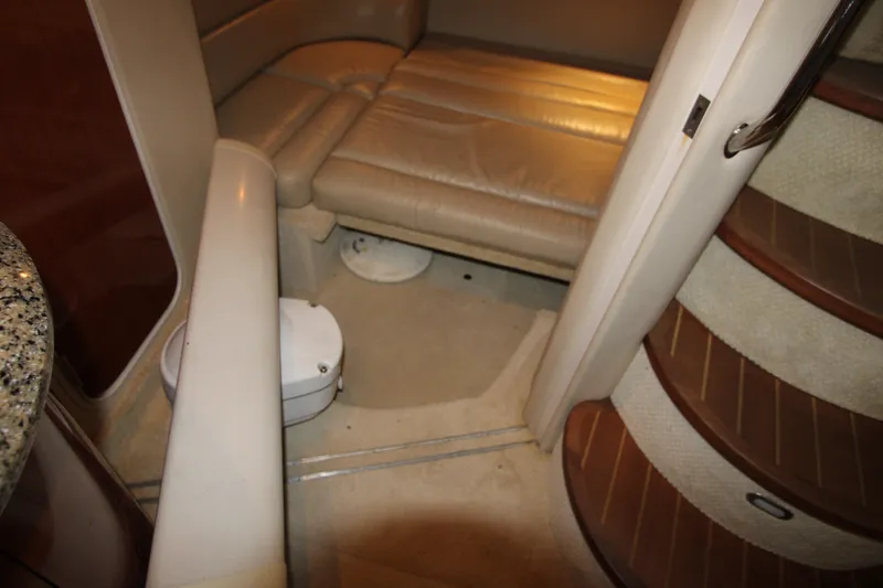 Slide: The Image of Interior of 2005 Sea Ray 420 Sundancer yacht with beige seating and carpeted stairs. - 23