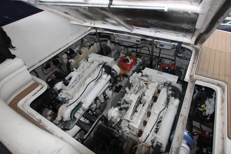 Slide: The Image of Engine compartment of a 2005 Sea Ray 420 Sundancer yacht, showcasing dual engines. - 27