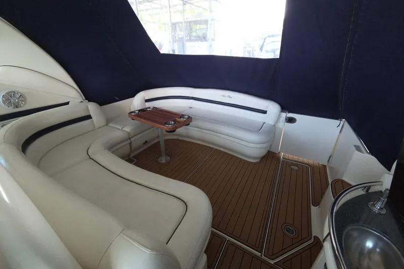 Slide: The Image of Luxurious 2005 Sea Ray 420 Sundancer yacht interior with elegant seating and wooden flooring. - 6