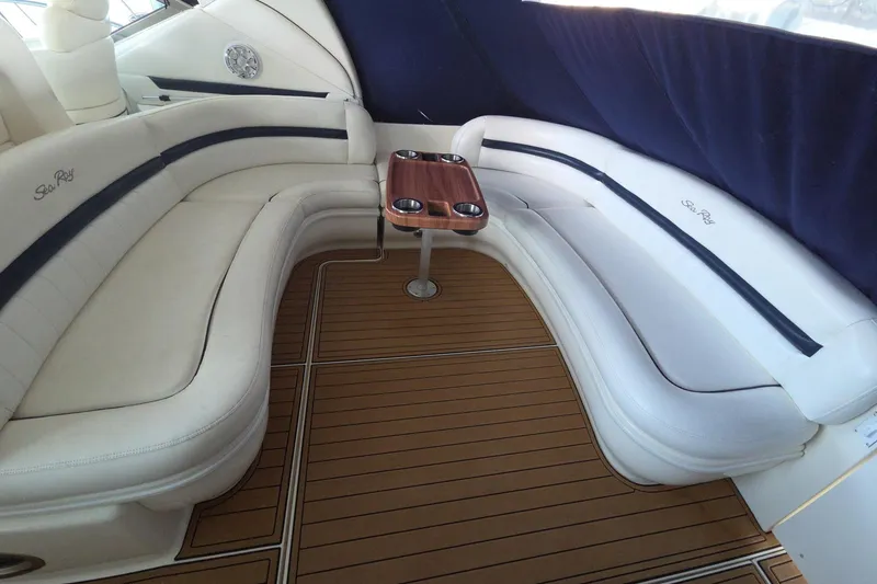 Slide: The Image of Luxurious seating area on a 2005 Sea Ray 420 Sundancer yacht with wooden flooring. - 5