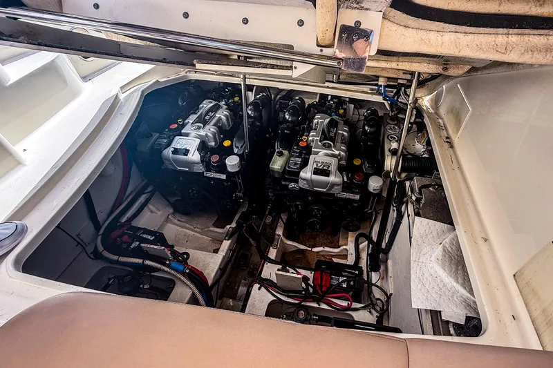 Slide: The Image of Engine compartment of a 2016 Sea Ray Sundancer 350 boat, showcasing dual engines. - 13