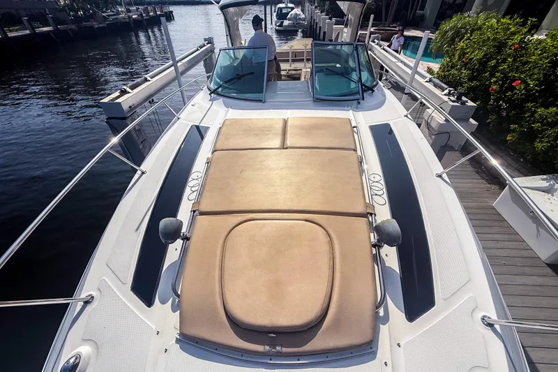 Slide: The Image of 2016 Sea Ray Sundancer 350 yacht with sunpad, docked by waterfront. - 40