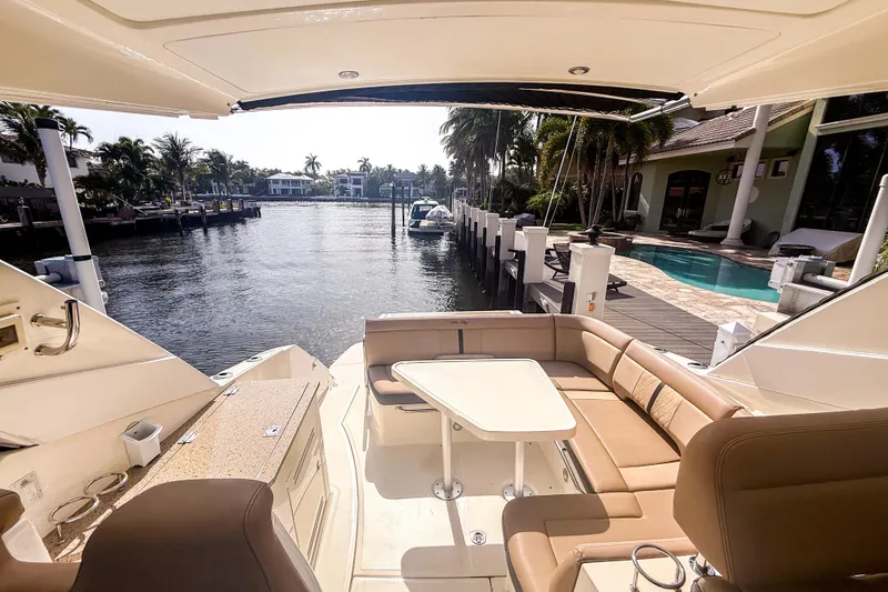 Slide: The Image of Luxurious 2016 Sea Ray Sundancer 350 yacht docked by waterfront home with pool. - 11