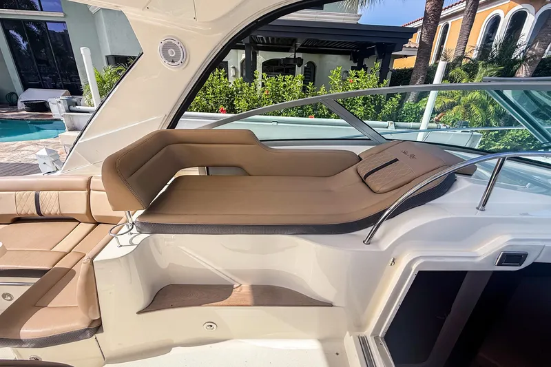 Slide: The Image of 2016 Sea Ray Sundancer 350 boat interior with luxurious tan seating. - 18