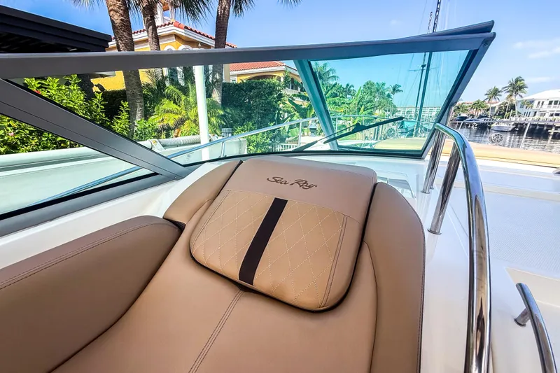 Slide: The Image of Luxurious 2016 Sea Ray Sundancer 350 boat interior with tan seating and waterfront view. - 20