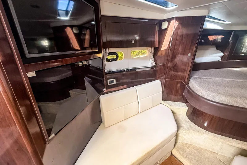 Slide: The Image of Luxurious interior of 2016 Sea Ray Sundancer 350 yacht with TV and seating area. - 29