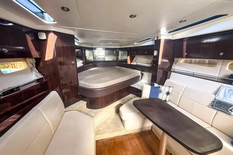 Slide: The Image of Luxurious interior of 2016 Sea Ray Sundancer 350 yacht with elegant seating and wood finishes. - 27