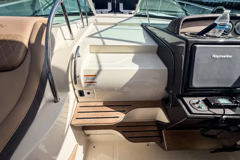 Slide: The Image of Interior of 2016 Sea Ray Sundancer 350 boat with Raymarine equipment and seating area. - 33