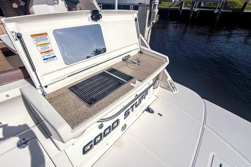 Slide: The Image of Outdoor grill on 2016 Sea Ray Sundancer 350 yacht, docked by the water. - 8