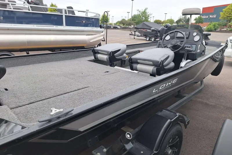 Slide: The Image of 2023 Lowe Skorpion 17 fishing boat with dual seats and steering console. - 14