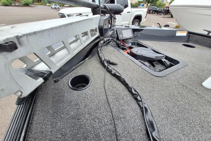 Slide: The Image of 2023 Lowe Skorpion 17 boat deck with fishing equipment and control panel. - 21