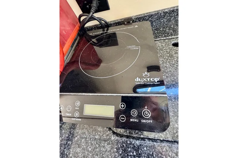 Slide: The Image of Duxtop induction cooktop on Birchwood Challenger 450 Flybridge, 1999 model, granite countertop. - 25