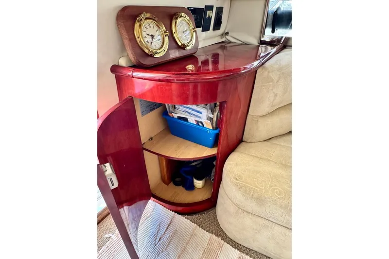 Slide: The Image of Interior of 1999 Birchwood Challenger 450 Flybridge with wooden cabinet and nautical decor. - 14