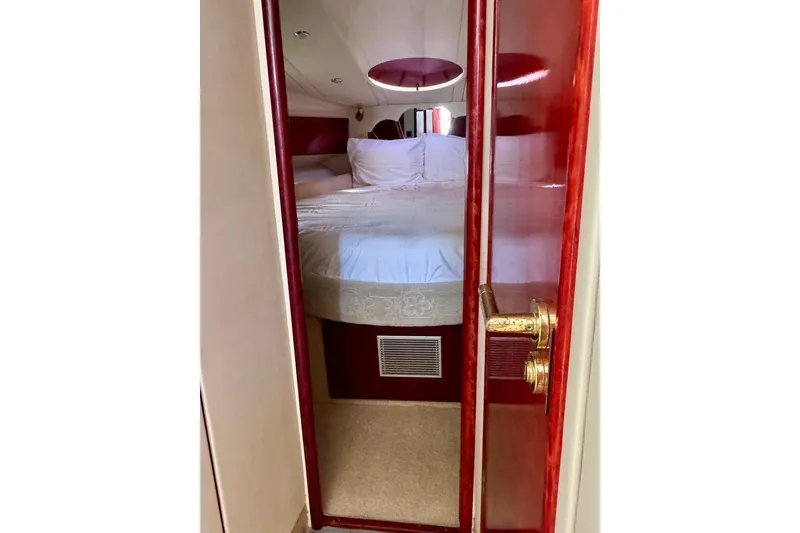 Slide: The Image of Interior cabin view of 1999 Birchwood Challenger 450 Flybridge yacht with elegant wood finish. - 32