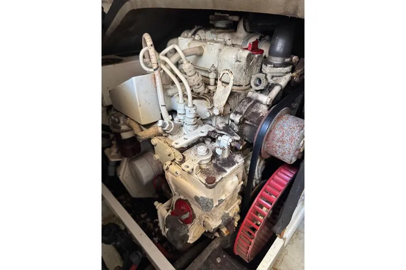 Slide: The Image of Engine of a 1999 Birchwood Challenger 450 Flybridge boat, showing mechanical components. - 48