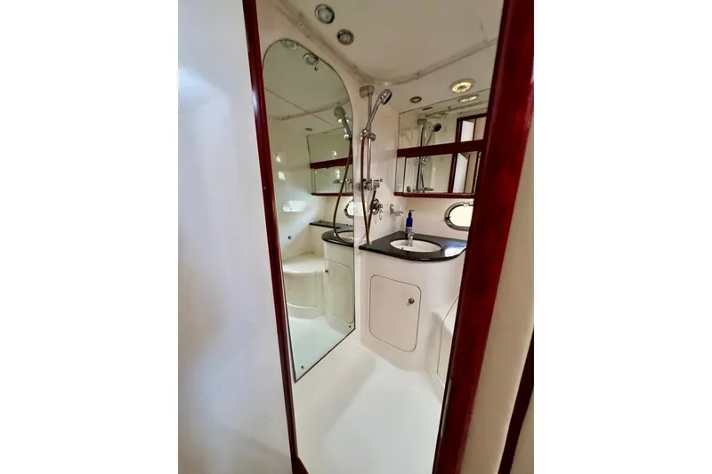 Slide: The Image of Bathroom interior of 1999 Birchwood Challenger 450 Flybridge yacht, featuring shower and sink. - 39