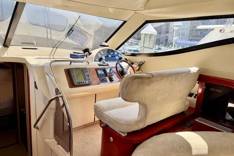 Slide: The Image of Interior helm of 1999 Birchwood Challenger 450 Flybridge with navigation instruments. - 19