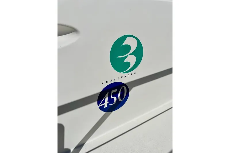 Slide: The Image of Logo of Birchwood Challenger 450 Flybridge, 1999 model, on a white surface. - 49