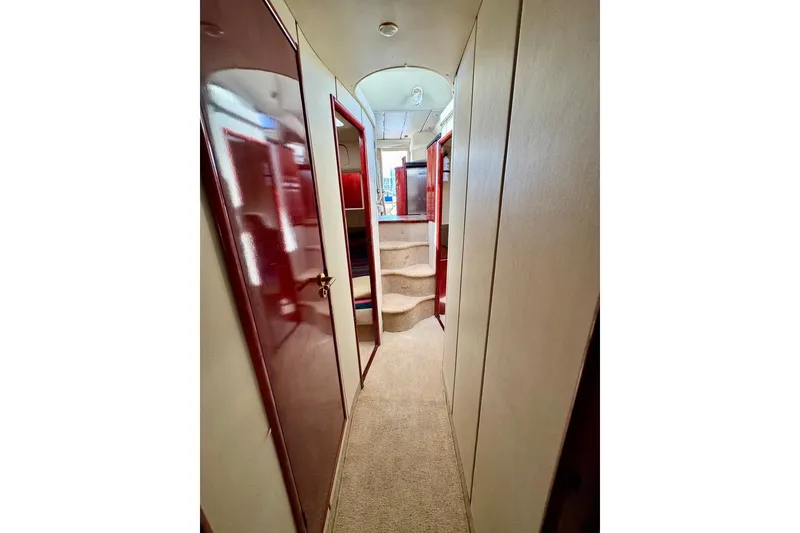 Slide: The Image of Interior hallway of 1999 Birchwood Challenger 450 Flybridge yacht with carpeted stairs. - 36