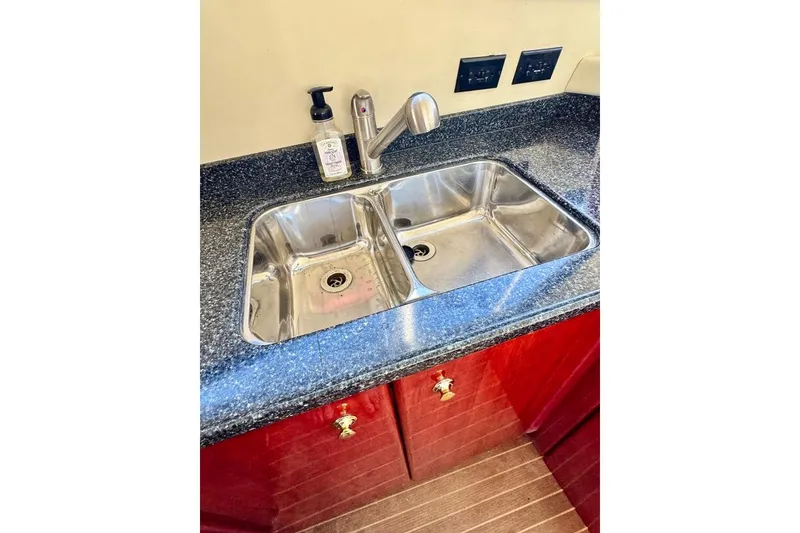 Slide: The Image of Stainless steel double sink in Birchwood Challenger 450 Flybridge, 1999 model yacht kitchen. - 28