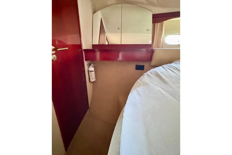 Slide: The Image of Interior of 1999 Birchwood Challenger 450 Flybridge with mirror and fire extinguisher. - 34