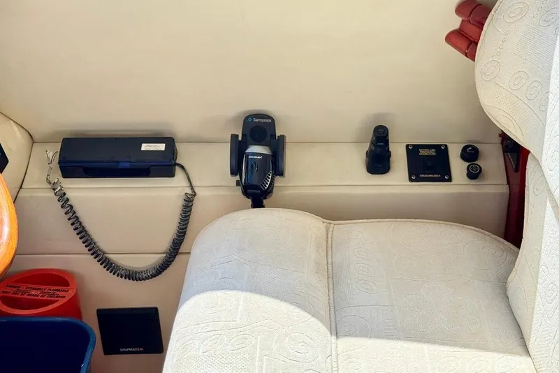 Slide: The Image of Control panel of a 1999 Birchwood Challenger 450 Flybridge with communication equipment. - 22