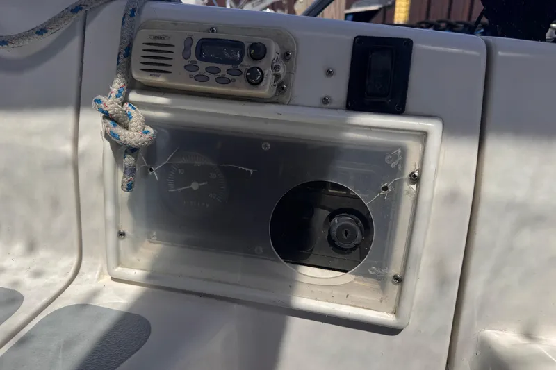 Slide: The Image of Control panel of a 1993 Hunter 33.5 sailboat with radio and gauge. - 14