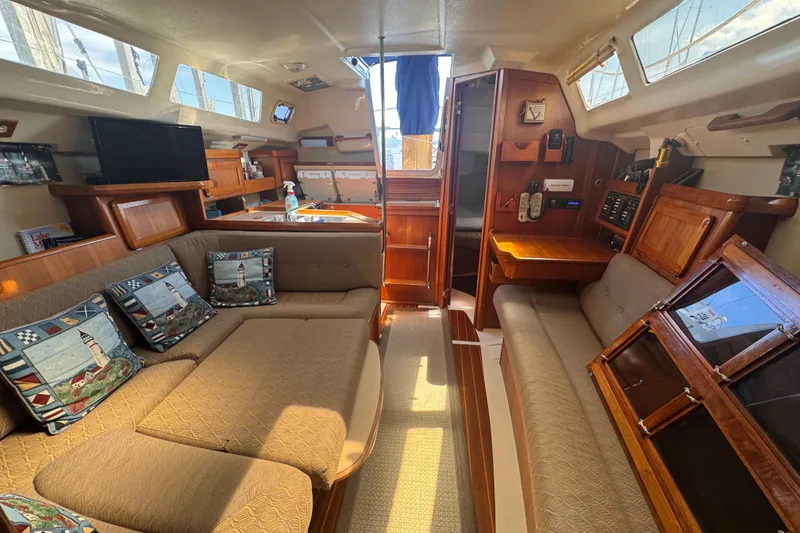 Slide: The Image of Interior of a 1993 Hunter 33.5 sailboat with cozy seating and nautical decor. - 40