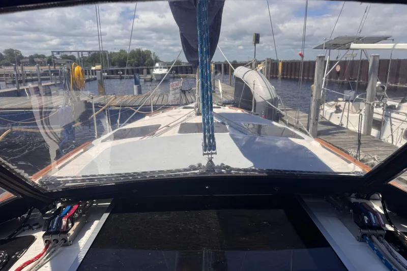 Slide: The Image of Cockpit view of a 1993 Hunter 33.5 sailboat docked at a marina. - 9