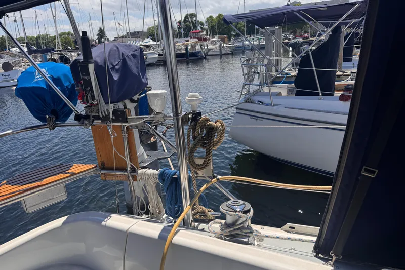 Slide: The Image of Hunter 33.5 sailboat from 1993 docked at a marina with other boats. - 12