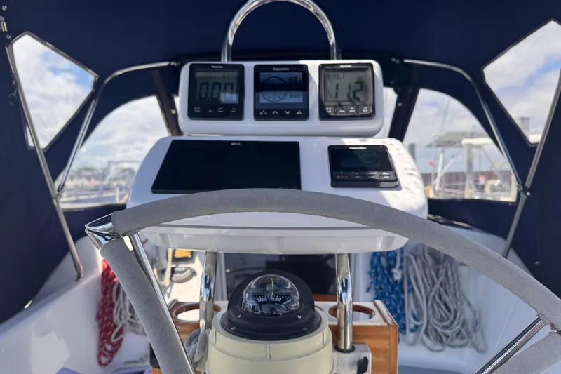 Slide: The Image of Cockpit view of a 1993 Hunter 33.5 sailboat with navigation instruments and compass. - 17