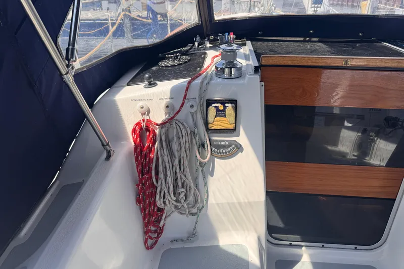 Slide: The Image of Cockpit of 1993 Hunter 33.5 sailboat with ropes and winch. - 22