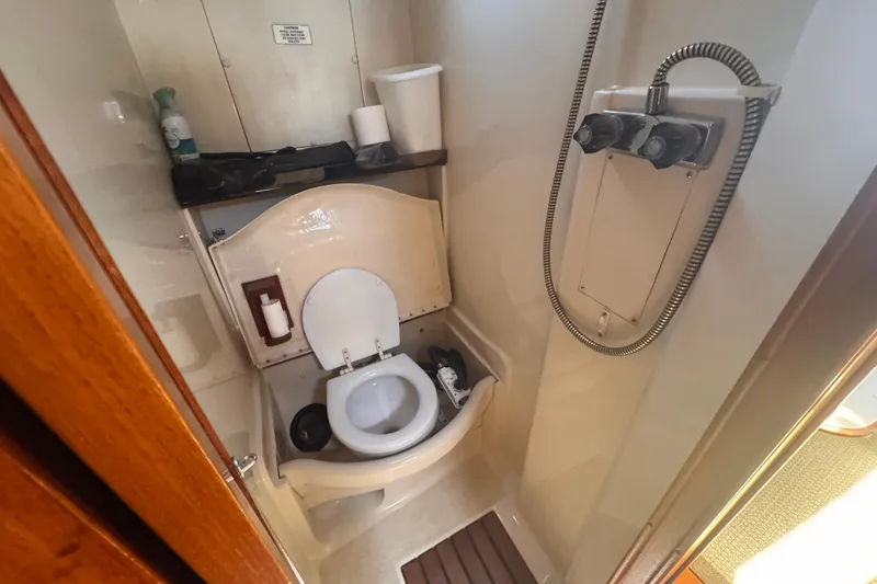 Slide: The Image of Compact bathroom in a 1993 Hunter 33.5 sailboat with toilet and shower. - 34