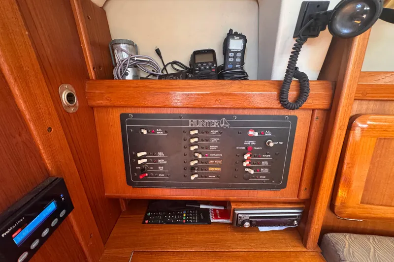 Slide: The Image of Electrical panel of a 1993 Hunter 33.5 sailboat with communication devices. - 42