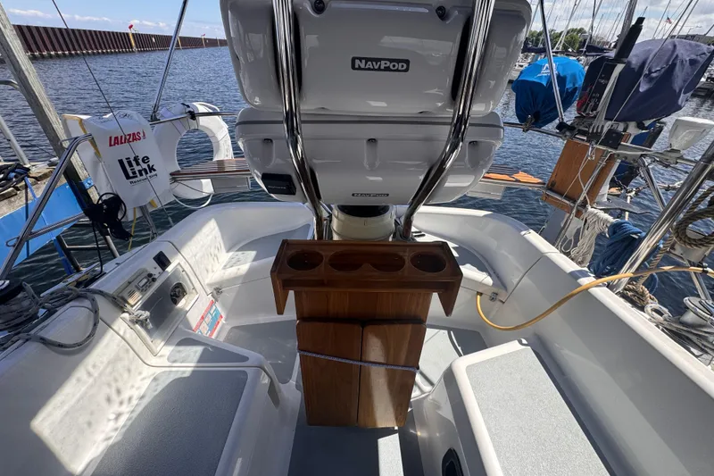 Slide: The Image of Cockpit of a 1993 Hunter 33.5 sailboat with NavPod and life-saving equipment. - 15