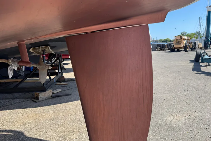 Slide: The Image of Close-up of a 1993 Hunter 33.5 sailboat keel and propeller in a boatyard. - 6