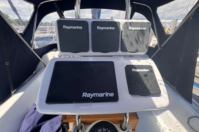 Slide: The Image of Cockpit of 1993 Hunter 33.5 sailboat with Raymarine navigation equipment. - 16