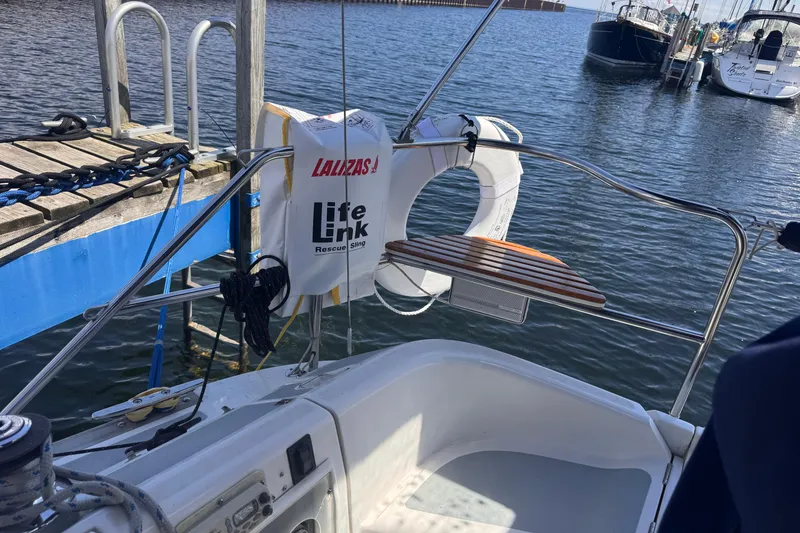 Slide: The Image of Cockpit of 1993 Hunter 33.5 sailboat with life ring and rescue sling. - 13