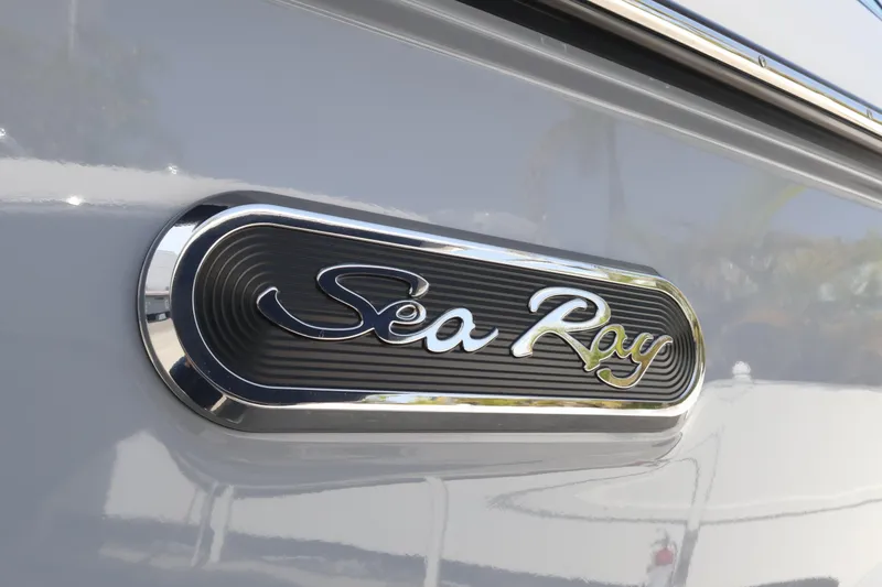 Slide: The Image of 2024 Sea Ray SLX 260 Outboard logo on sleek boat exterior. - 2