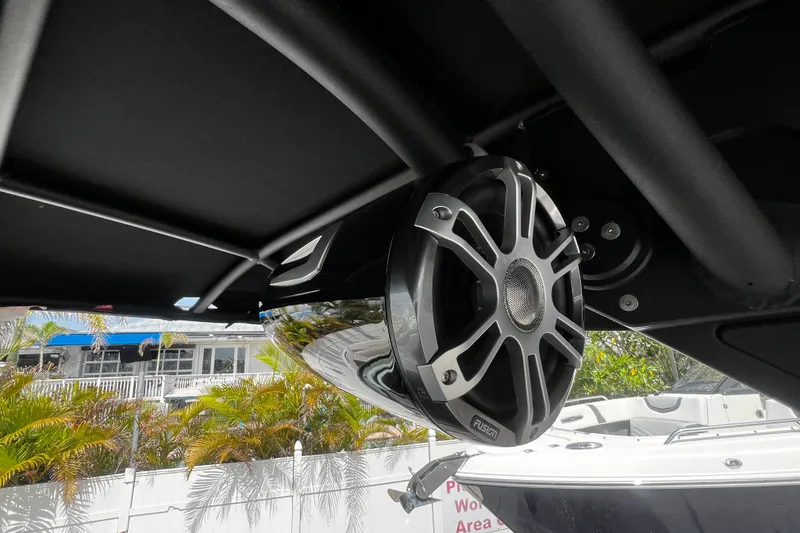 Slide: The Image of 2024 Sea Ray SLX 260 Outboard with Fusion marine speaker under canopy. - 40
