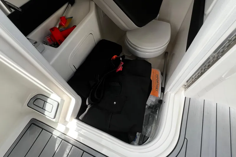 Slide: The Image of Interior storage area of 2024 Sea Ray SLX 260 Outboard boat with toilet and equipment. - 30