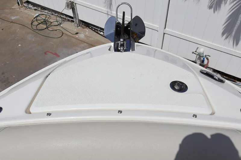 Slide: The Image of 2024 Sea Ray SLX 260 Outboard bow with anchor and deck details. - 13