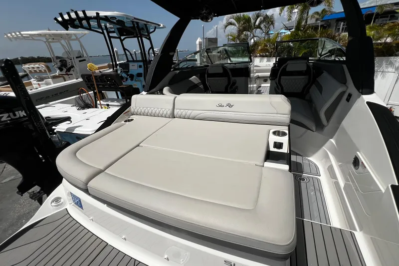 Slide: The Image of 2024 Sea Ray SLX 260 Outboard boat with luxurious seating and sleek design. - 44