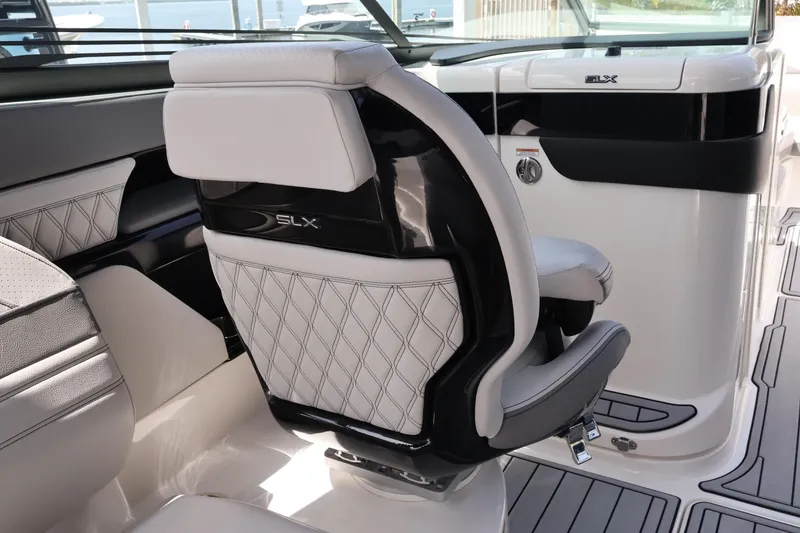 Slide: The Image of Luxurious interior of 2024 Sea Ray SLX 260 Outboard boat with elegant seating design. - 28