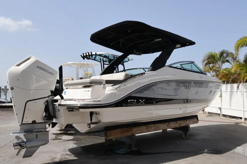 Slide: The Image of 2024 Sea Ray SLX 260 Outboard boat on display, featuring sleek design and powerful Mercury engine. - 8