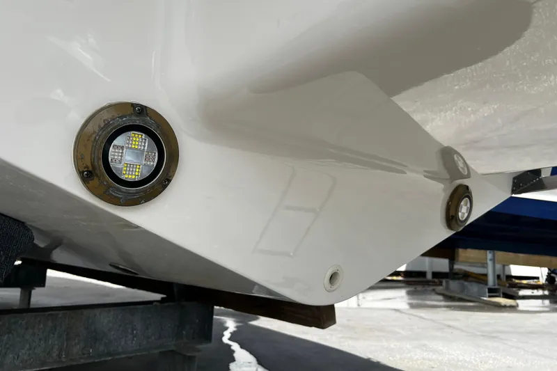 Slide: The Image of 2024 Sea Ray SLX 260 Outboard hull with underwater LED lights. - 46