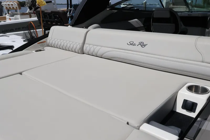 Slide: The Image of 2024 Sea Ray SLX 260 Outboard boat interior with luxurious seating and cup holders. - 41