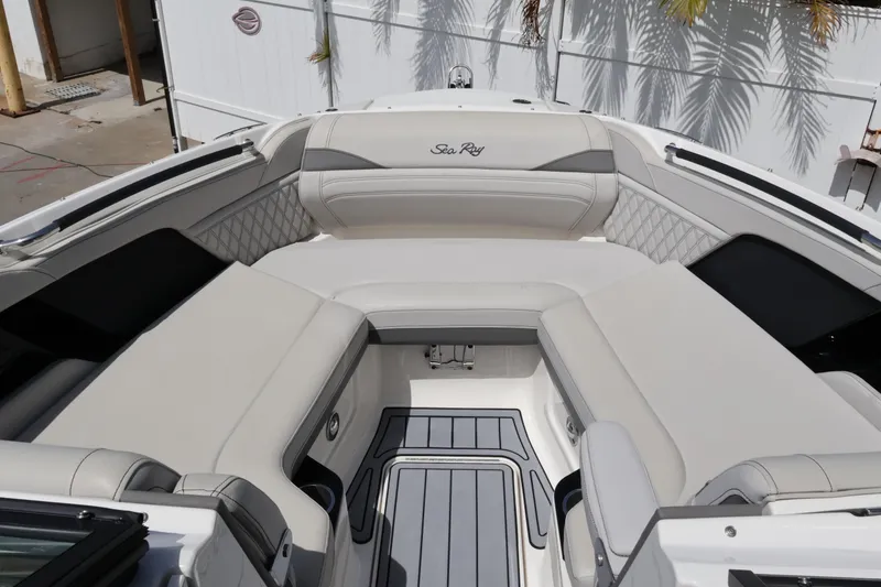 Slide: The Image of 2024 Sea Ray SLX 260 Outboard boat interior with luxurious seating and elegant design. - 15