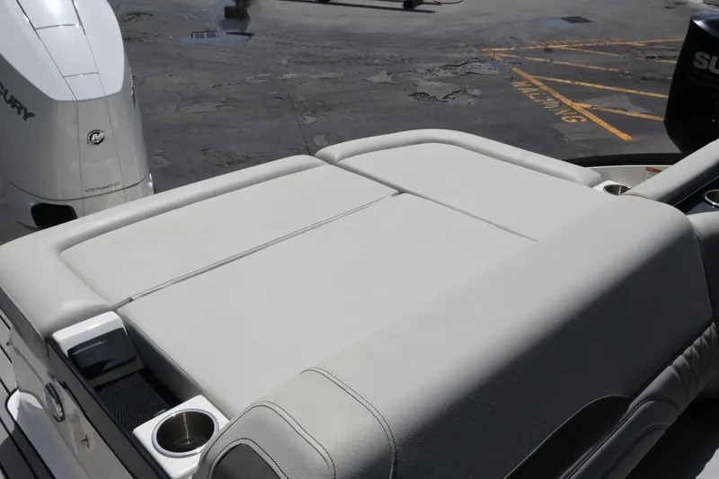 Slide: The Image of 2024 Sea Ray SLX 260 Outboard boat with spacious sunpad and cup holders. - 42